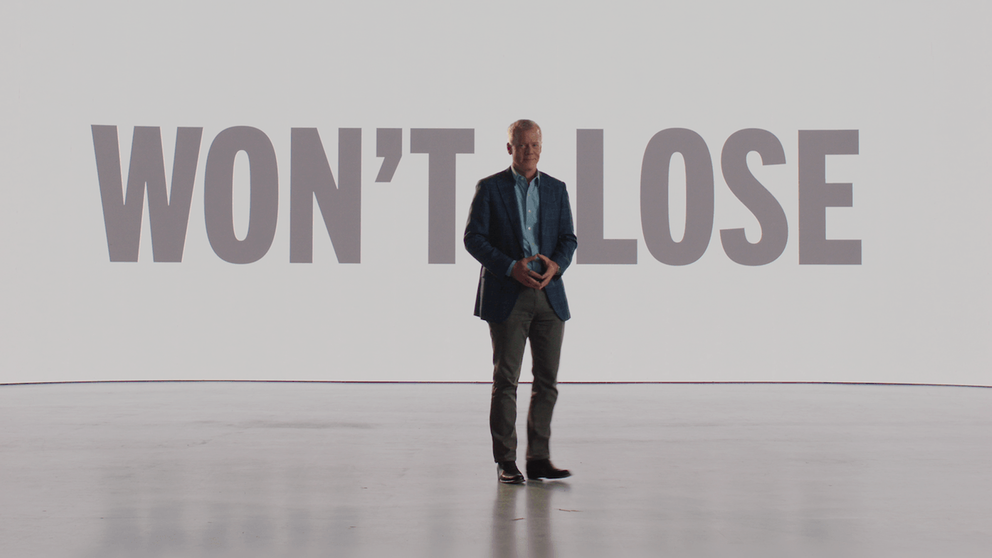Still from the BMS Won't Lose Voices video featuring the Won't Lose logo and a person standing in front of it